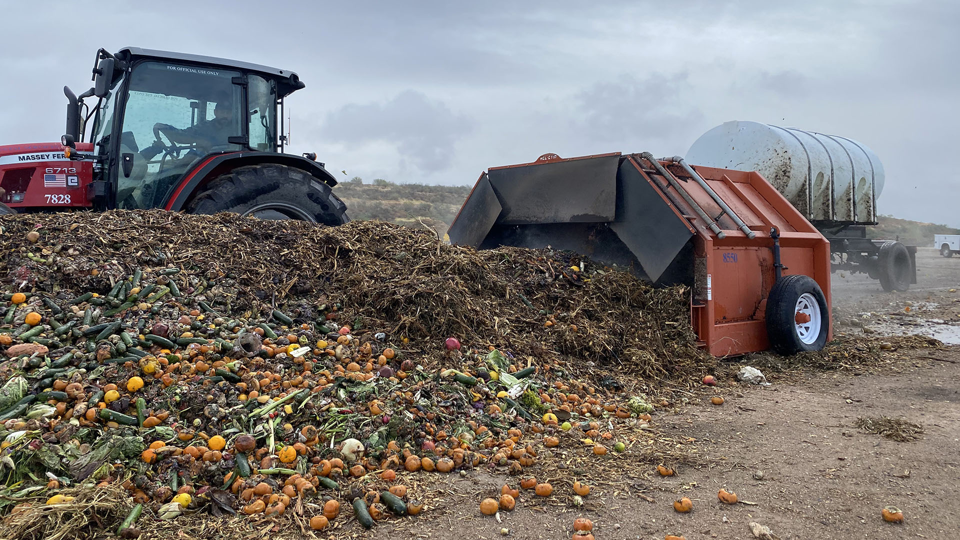 Food scraps being turned by industrial compost turner at Los Reales Composting Facility.