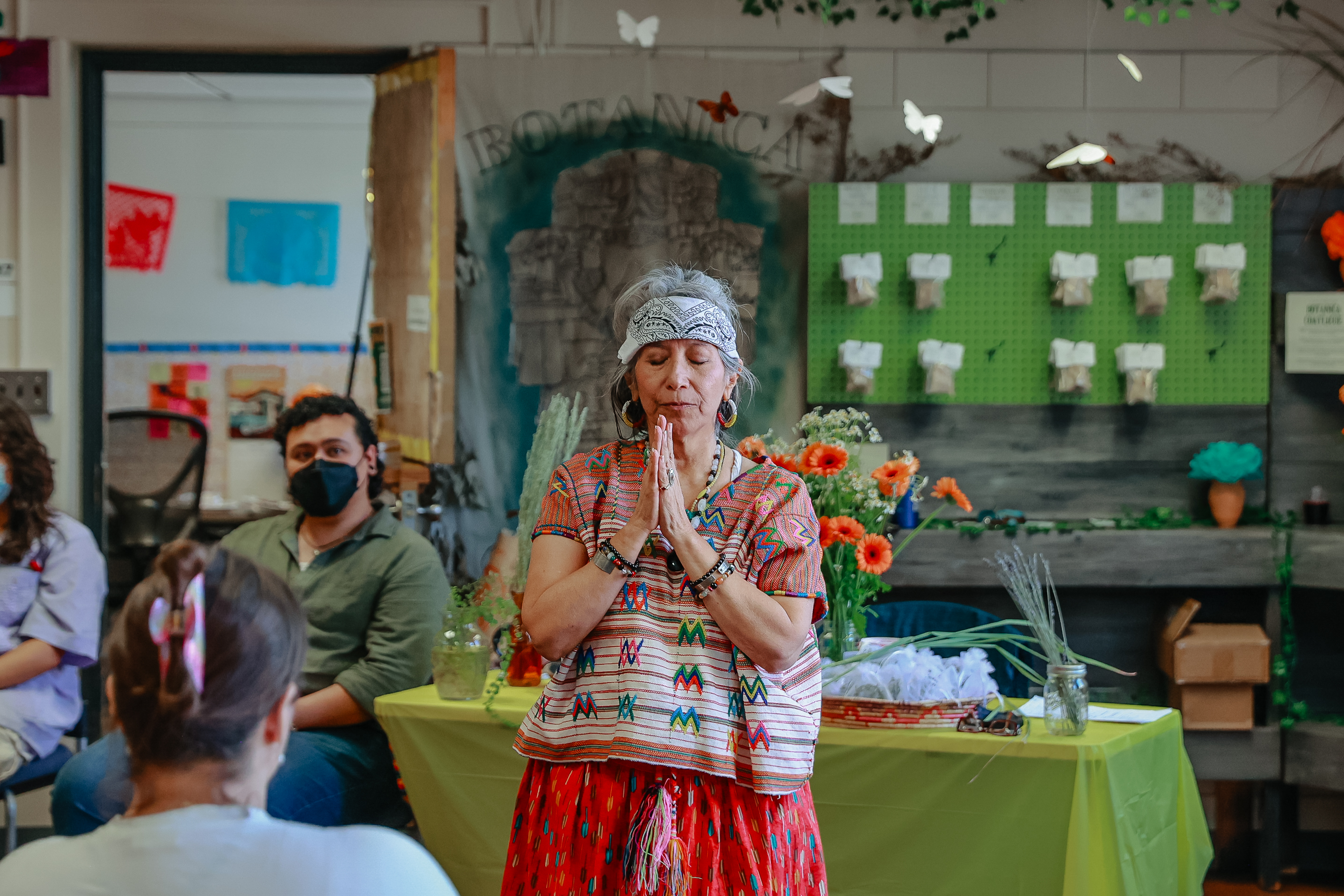 An indigenous healer leads an opening ceremony