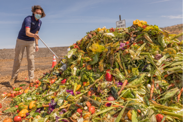 Student working with compost