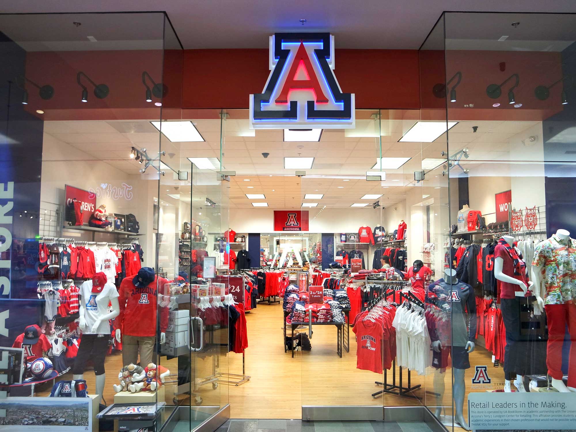 A brightly lit University of Arizona merchandise store, 