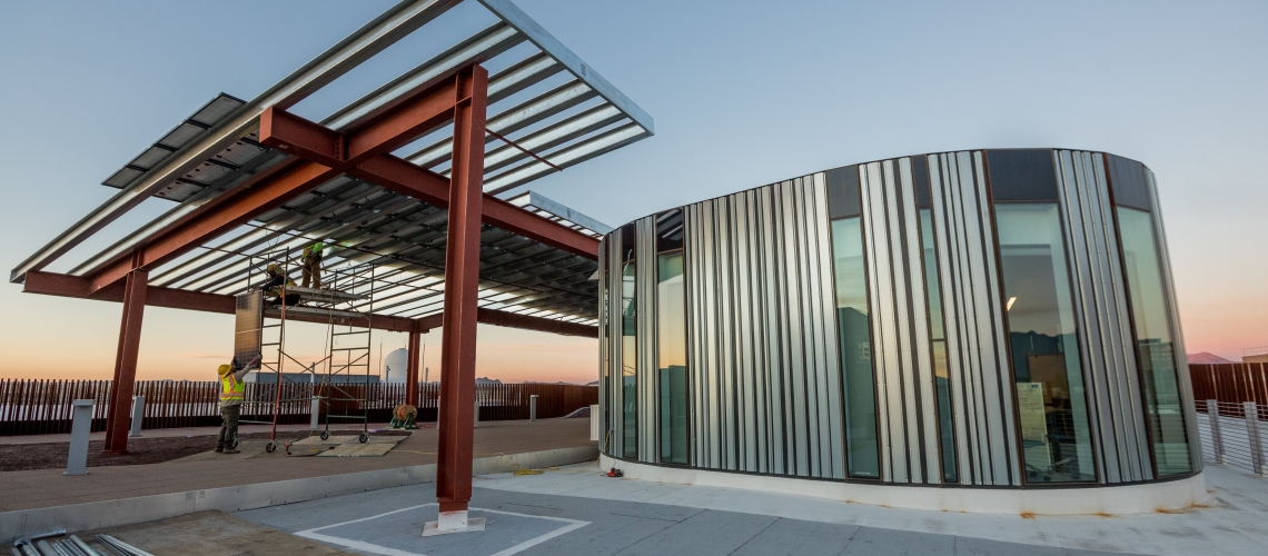 solar panel structure with sunrise in background