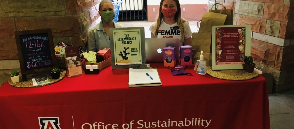 ExtraVAGanza Project team members staff a distribution table at the UArizona Campus Pantry.