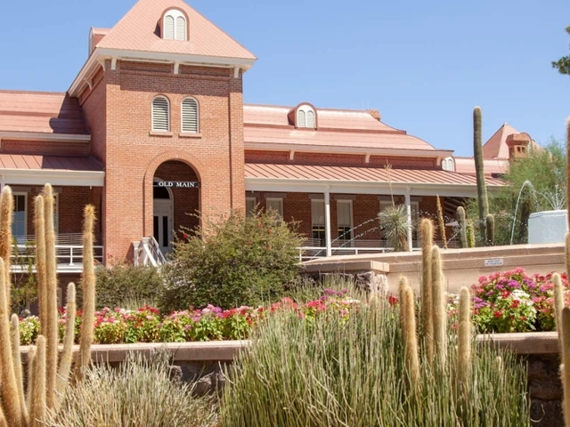 Old main with cacti in the foreground