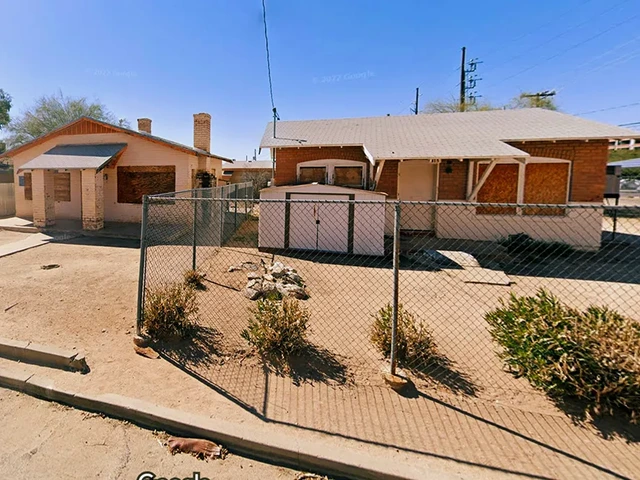 Two unused houses next to each other.