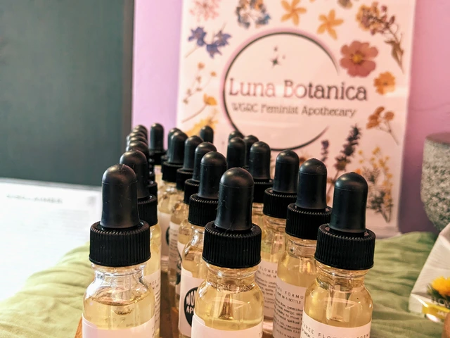 Multiple droppers on a wooden holder. The droppers include a Three Flowers Formula.