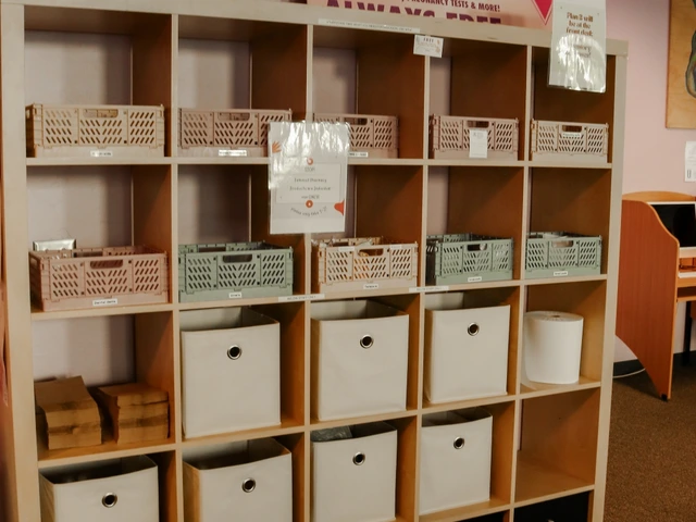 A large wooden cubby with multiple boxes that include hygiene products in it.