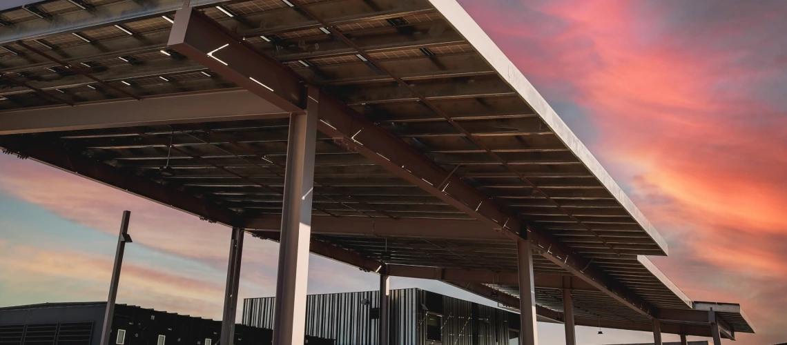 solar panels at sunset with colorful sky in background