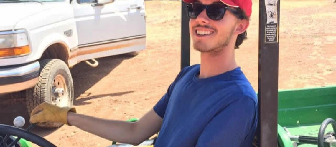 Daniel Collazo driving a gator