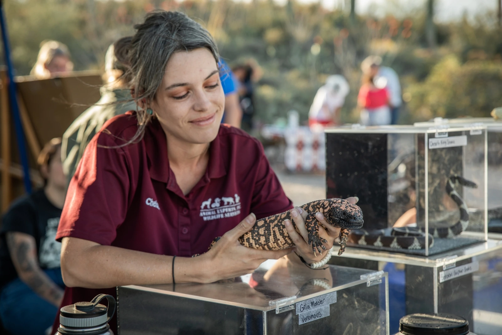 a girl holding an animal