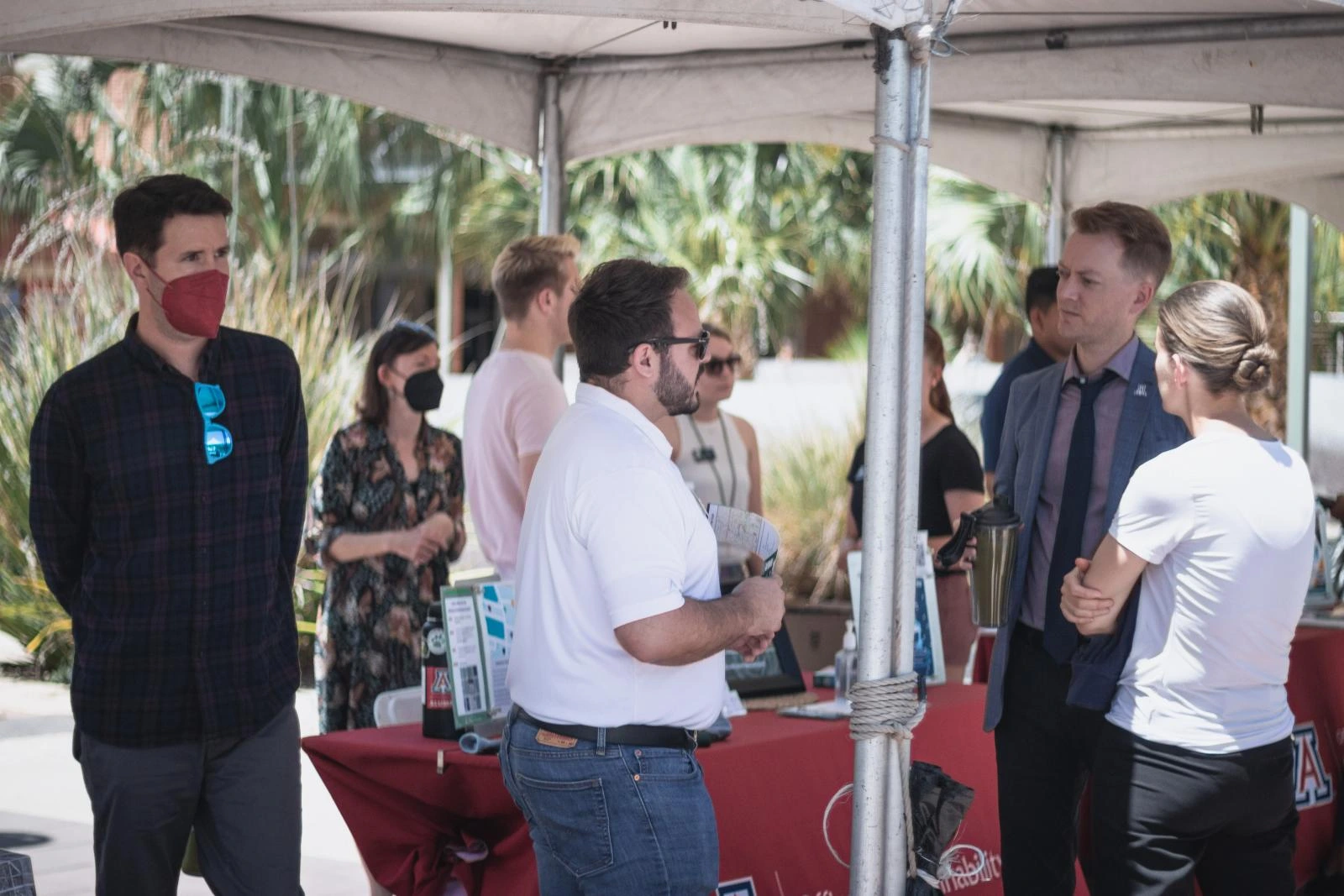 The staff of the Office of Sustainability present at the Office of Sustainability table at the Environmental Summit 2022.