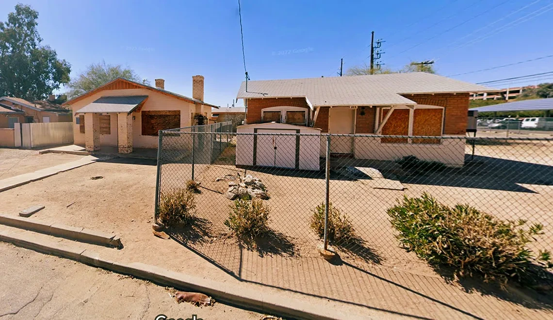 Two unused houses next to each other.