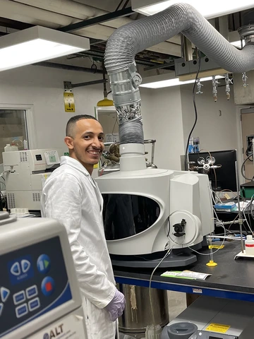 Fahad Alshammry, pictured wearing a white coat in the University of Arizona Chemistry lab.