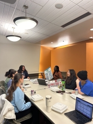 A group of people sitting together at a table. 