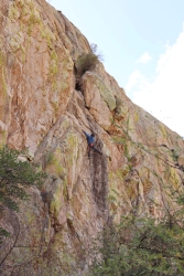 A person rock climbing.