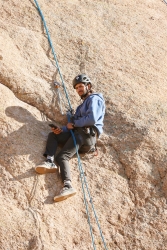 A person rock climbing.