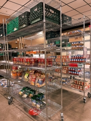 4 storage shelves with various packaged and canned foods. 