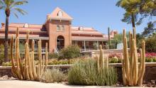 Old main with cacti in the foreground