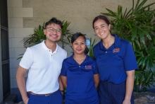 Javier Aguiniga with the WEST EJ Center poses with two employees of the Hawai'i Public Health Institute at a community outreach event. 