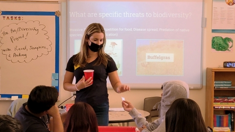 A person teaching a group of students. 