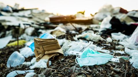 face masks accumulated in landfill